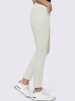 Pantalons skinny extensibles avec poches décoratives et fente