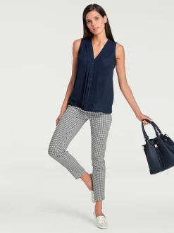 Pantalons skinny à poches fendues et motif géométrique