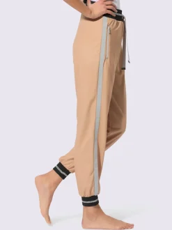 Pantalons sweat avec fils brillants et poches zippées