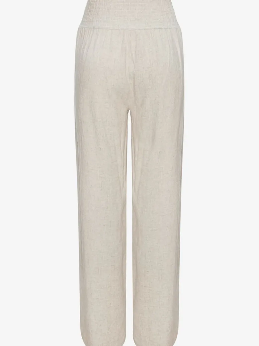 Pantalon structuré à ceinture smockée et poches latérales