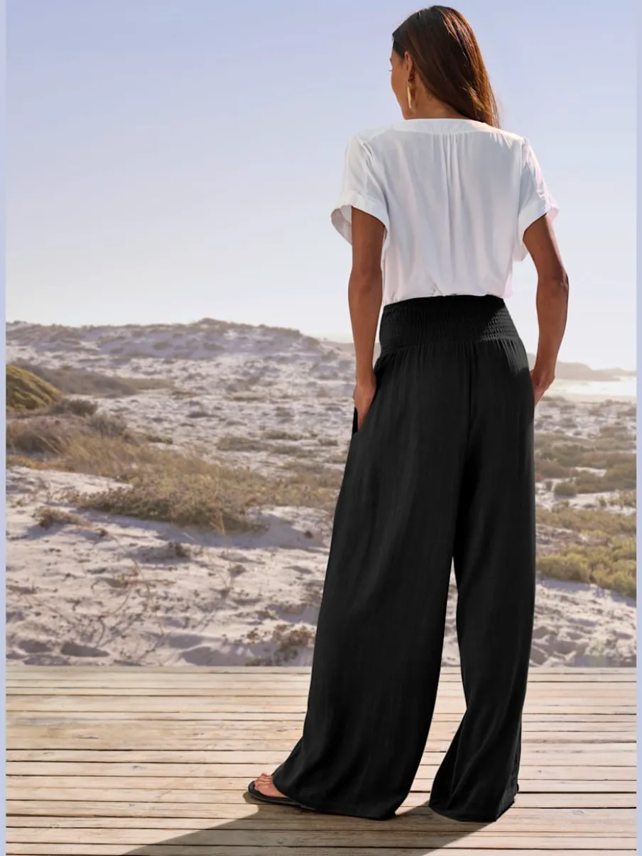 Pantalon structuré à ceinture smockée et poches latérales