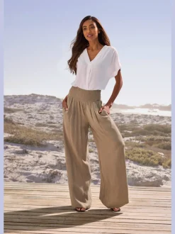 Pantalon structuré à ceinture smockée et poches latérales