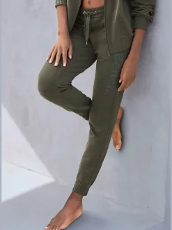 Pantalon sweat élastique doux avec poches à glissière et bords-côtes