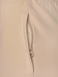 Pantalon sweat élastique doux avec poches à glissière et bords-côtes