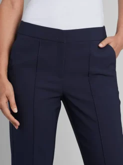 Pantalon tailleur avec nervures et poches latérales