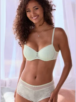 Panty fantaisie avec nœud décoratif fin et joli accessoire au centre devant