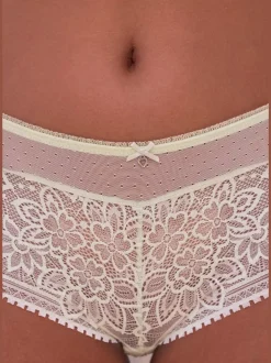 Panty fantaisie avec nœud décoratif fin et joli accessoire au centre devant