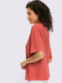 Polo à col zippé en mélange de matières douces et manches courtes