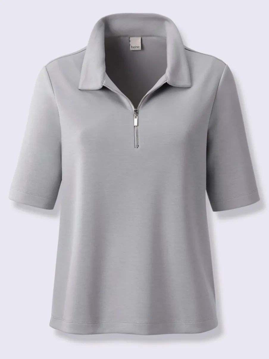 Polo à col zippé en mélange de matières douces et manches courtes