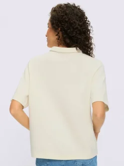 Polo à col zippé en mélange de matières douces et manches courtes