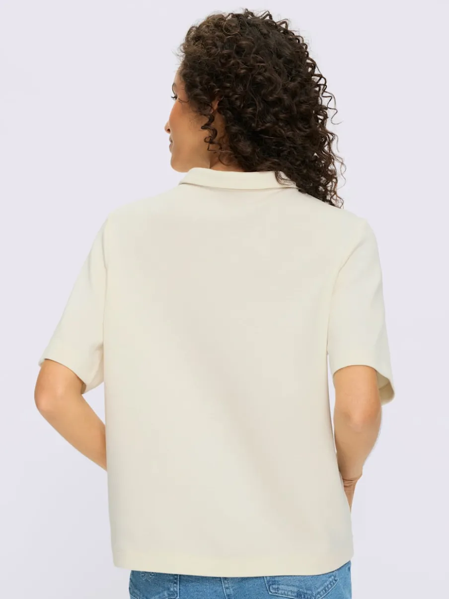Polo à col zippé en mélange de matières douces et manches courtes