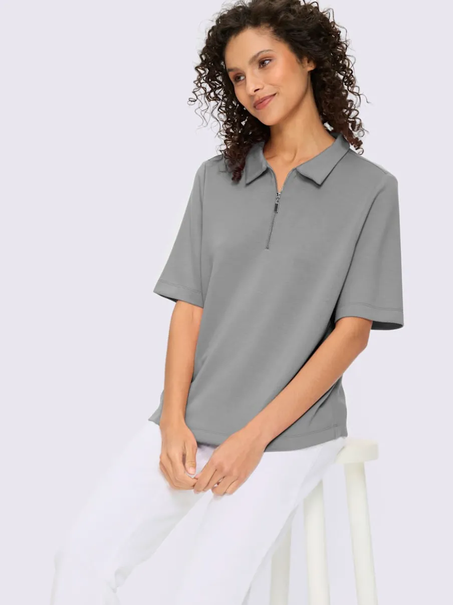 Polo à col zippé en mélange de matières douces et manches courtes