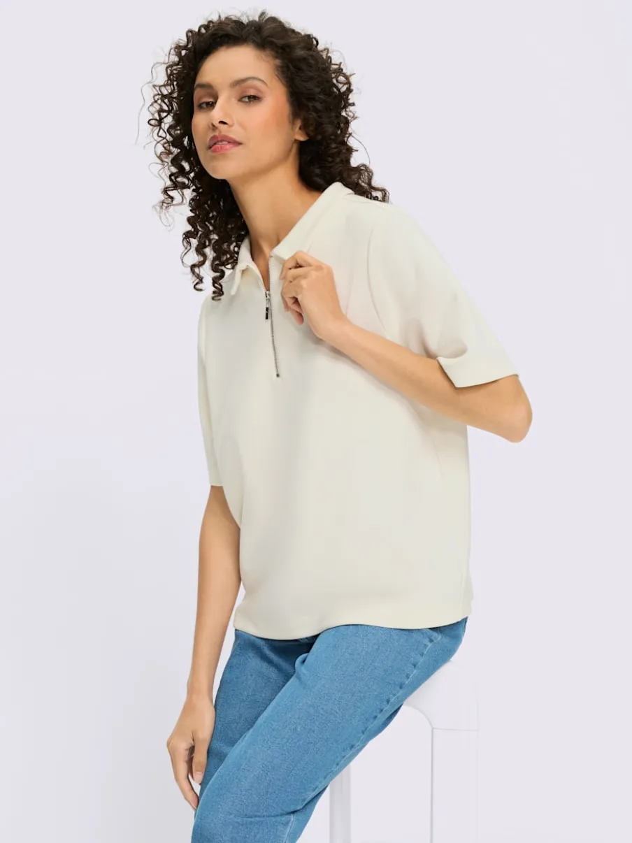 Polo à col zippé en mélange de matières douces et manches courtes