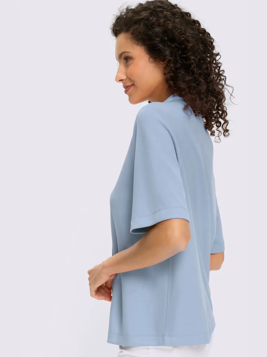 Polo à col zippé en mélange de matières douces et manches courtes