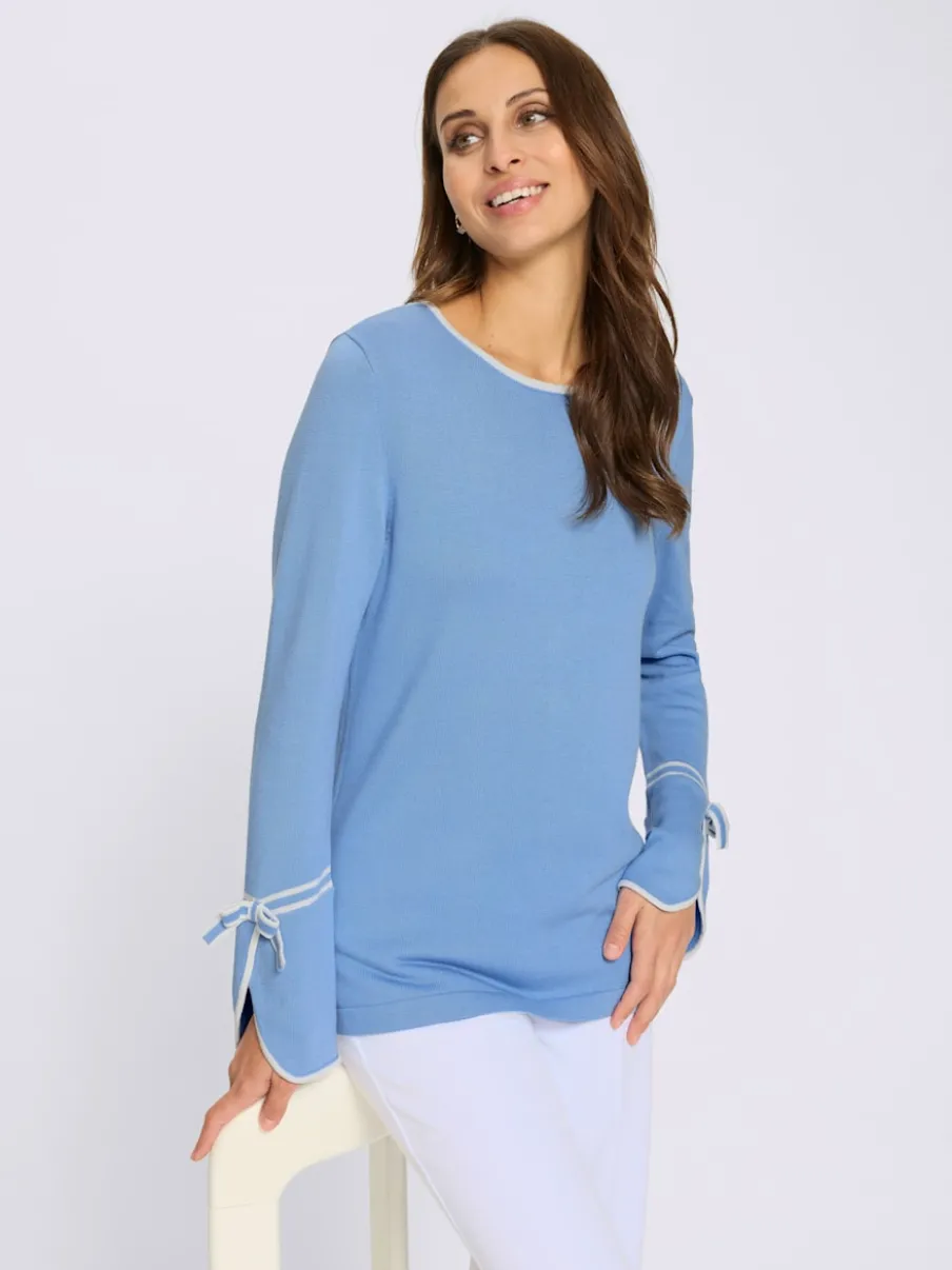 Pull au col rond avec finitions élégantes et doux nœuds