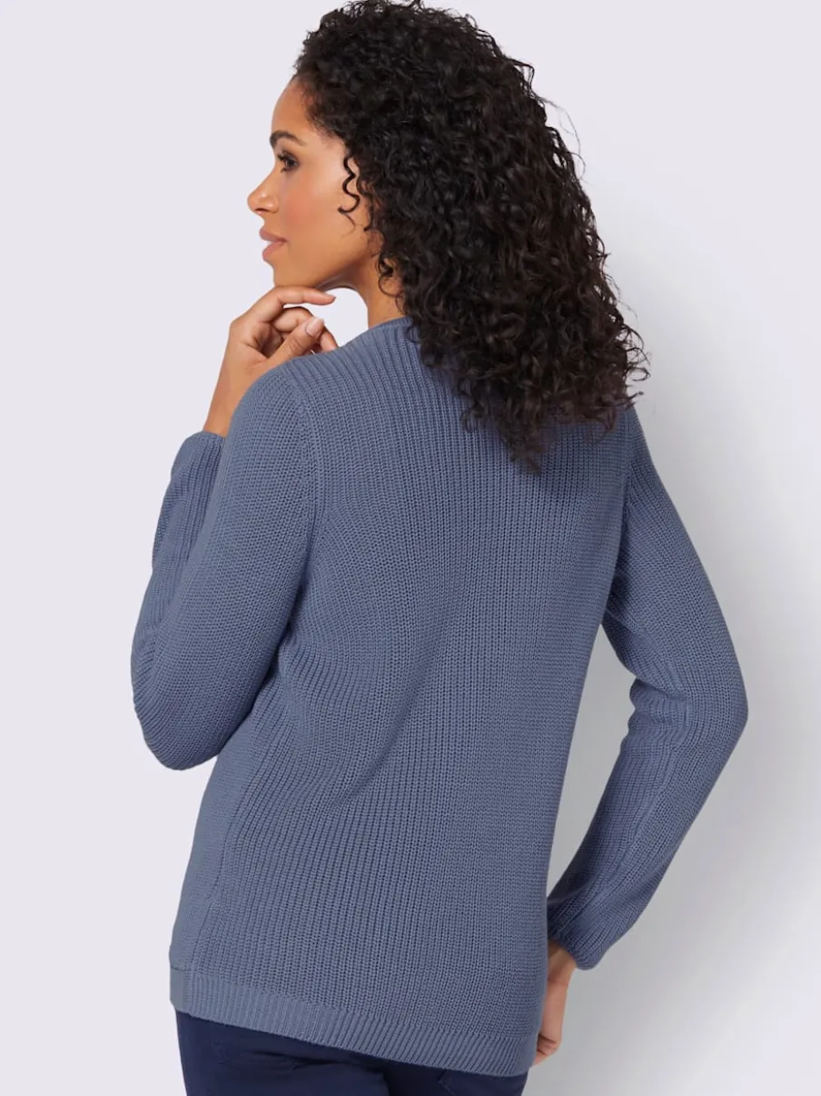 Pull avec boutonnières avant à effet affinant et côtelé