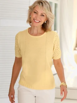Pull bouclé avec motif ajouré et manches côtelées