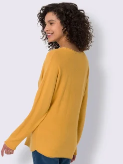Pull chauve-souris doux avec motif cœur brillant