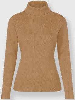 Pull col roulé avec découpes et perles fantaisie