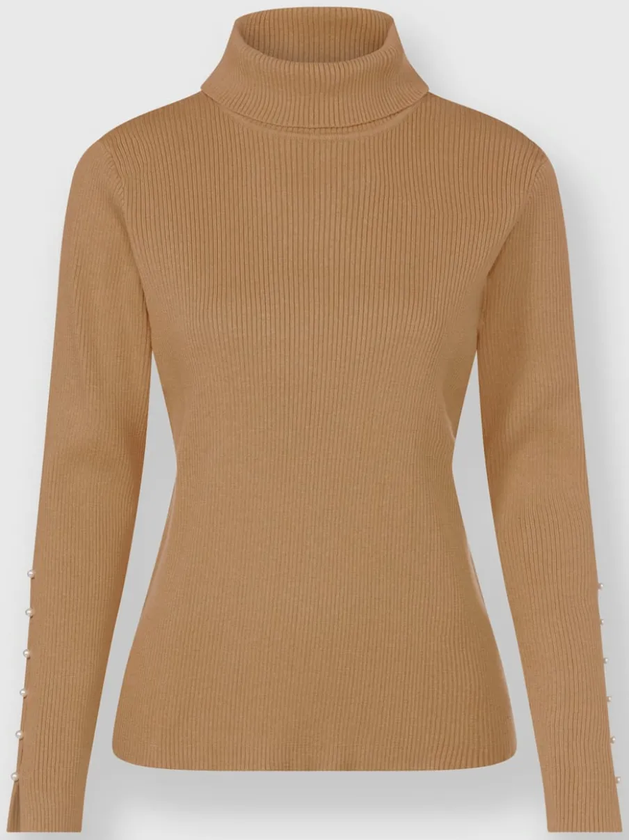 Pull col roulé avec découpes et perles fantaisie