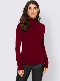 Pull à col roulé avec manches longues et boutons décoratifs