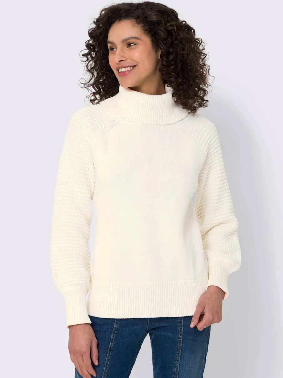 Pull à col roulé en pur coton avec manches ballon et bords-côtes