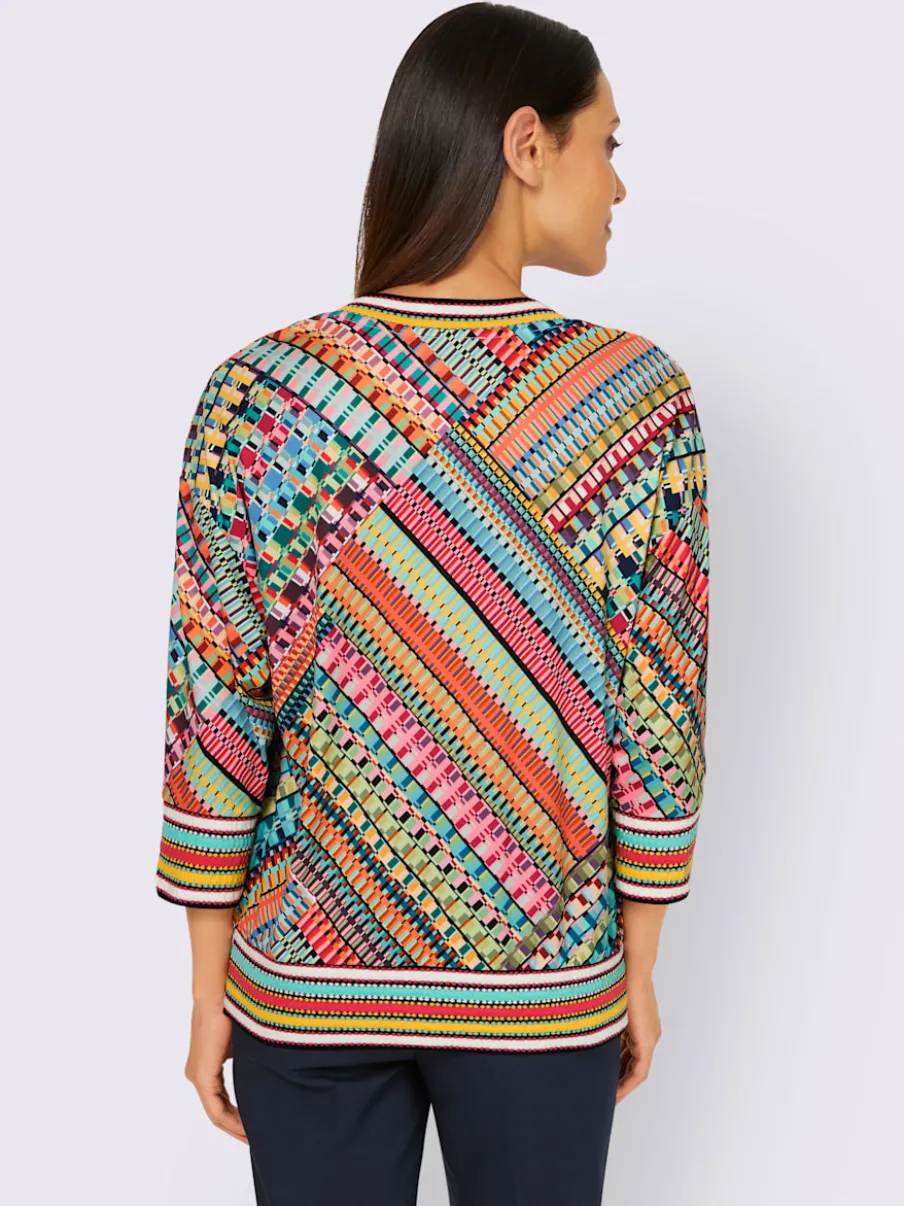 Pull encolure V motifs géométriques doux et fluides