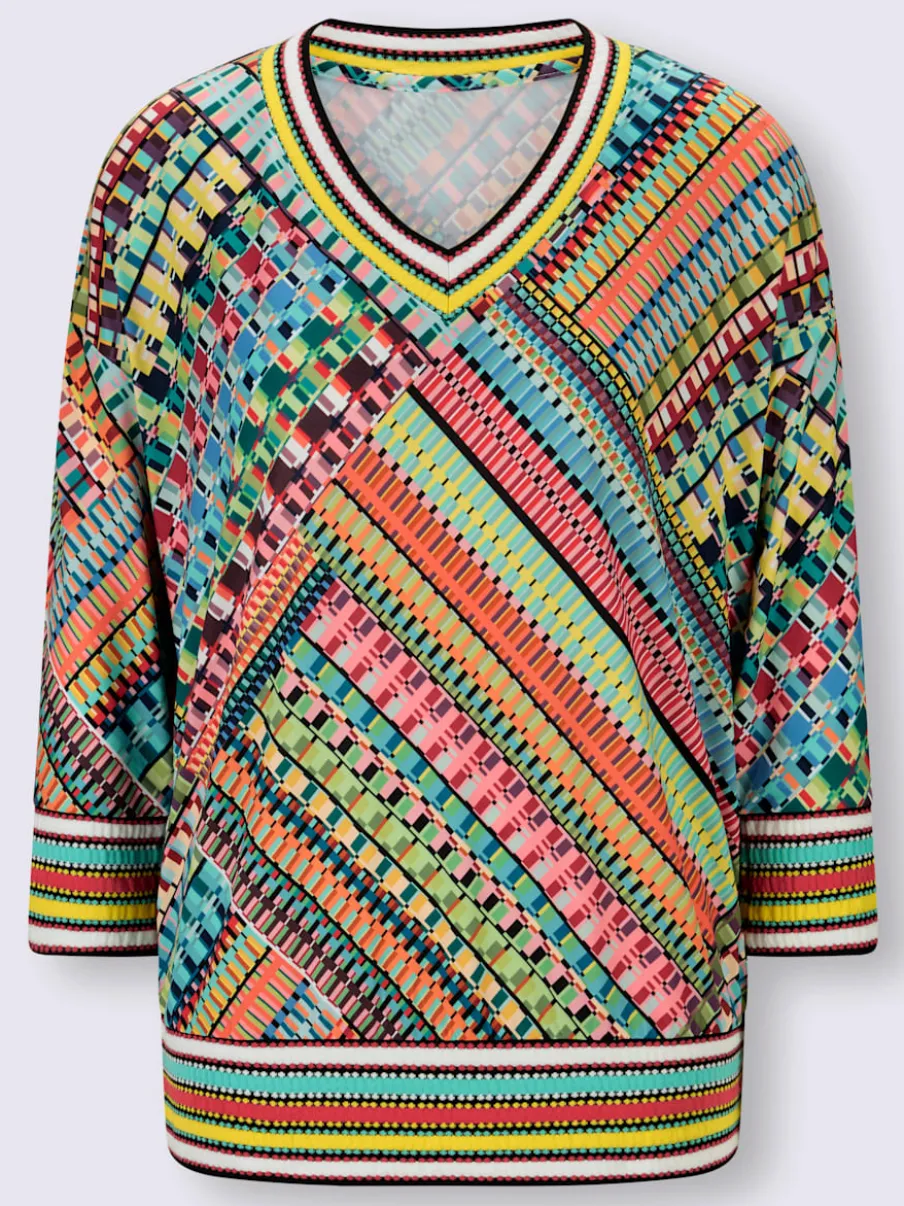 Pull encolure V motifs géométriques doux et fluides