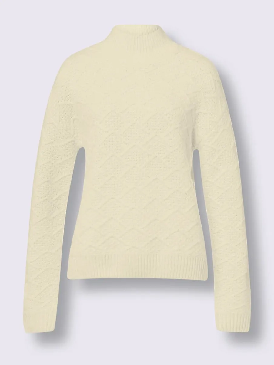 Pull en tricot avec col montant et motifs doux