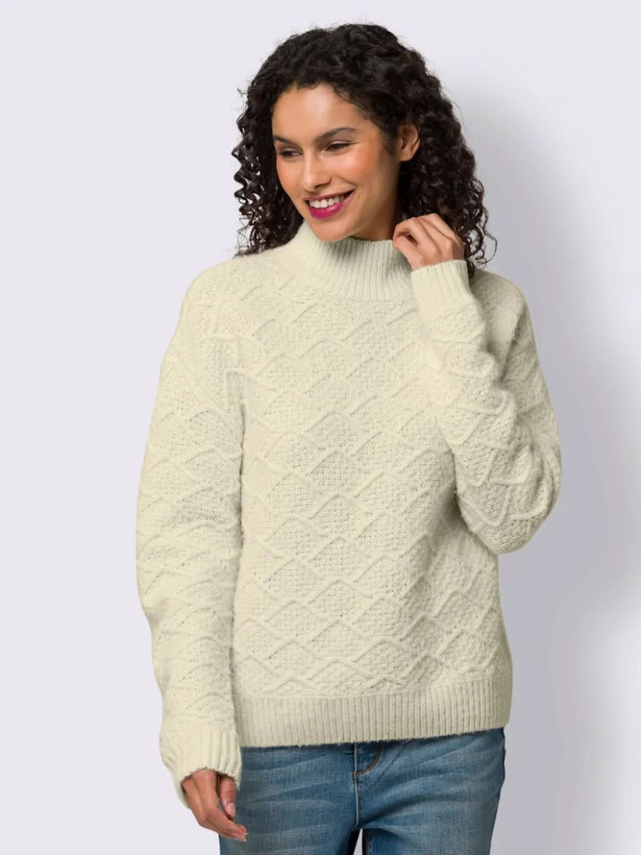 Pull en tricot avec col montant et motifs doux