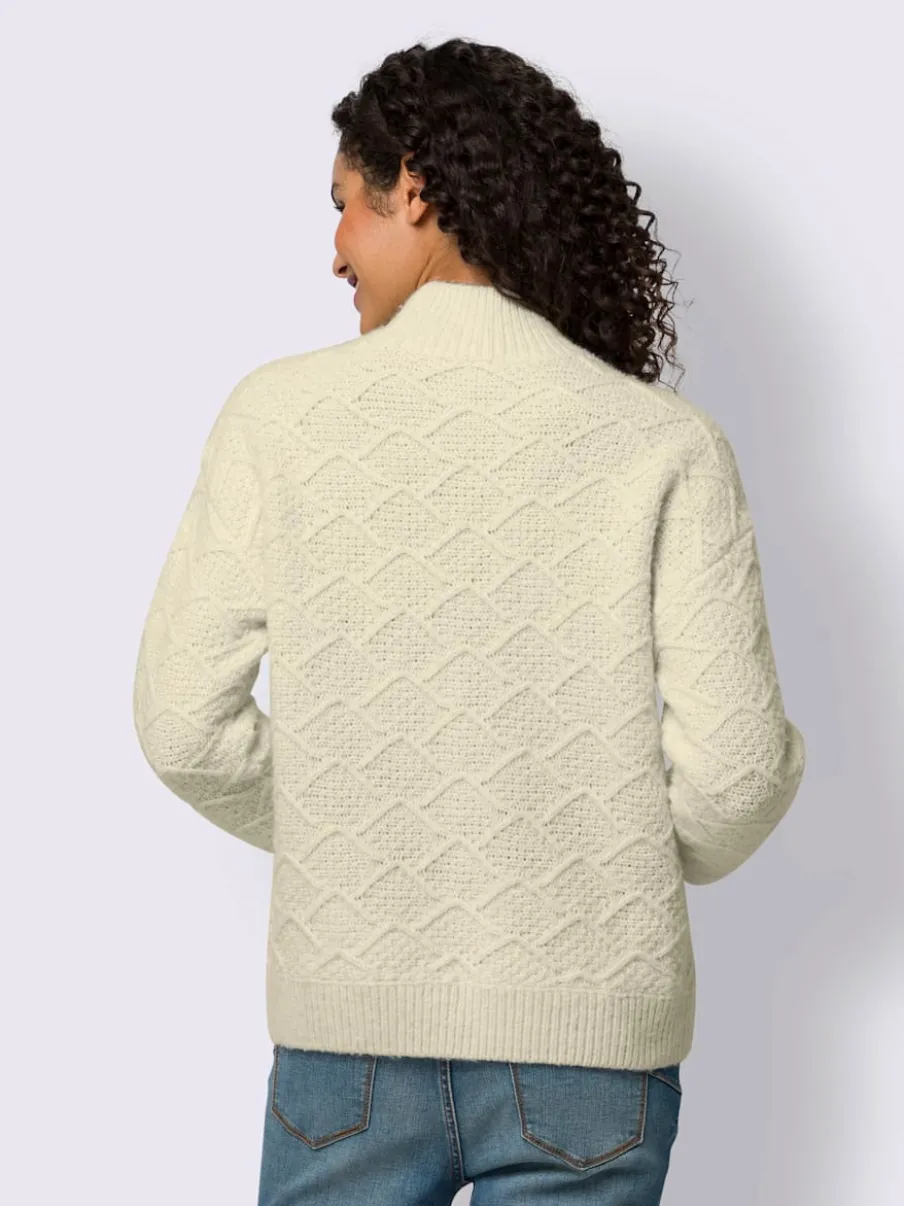 Pull en tricot avec col montant et motifs doux