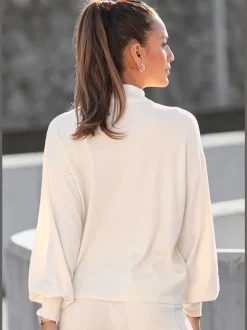 Pull en tricot avec col montant à larges manches et bords-côtes