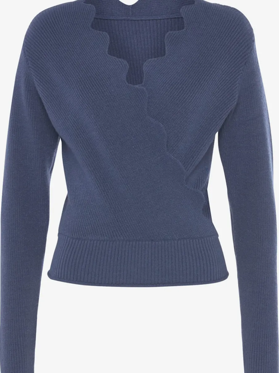 Pull en tricot à bord ondulé avec manches longues et tricot doux