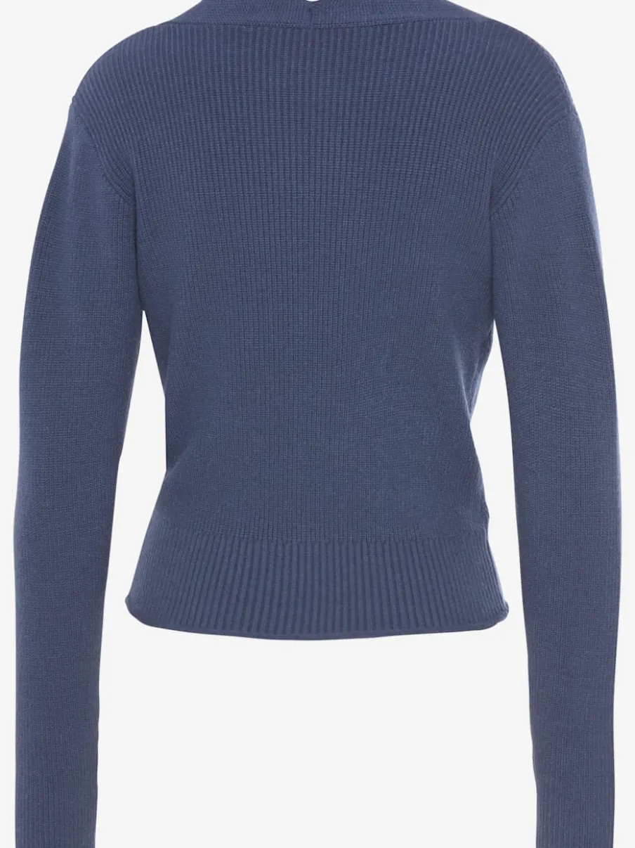Pull en tricot à bord ondulé avec manches longues et tricot doux