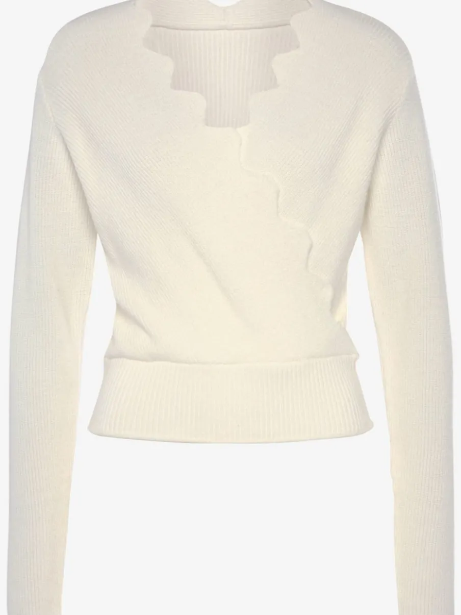 Pull en tricot à bord ondulé avec manches longues et tricot doux