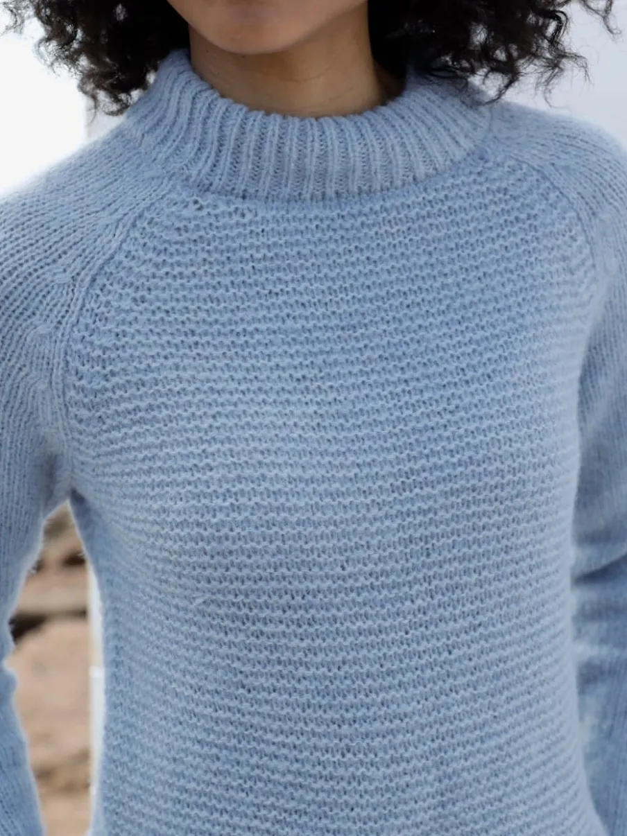Pull en tricot col montant à manches trois-quarts et bords-côtes