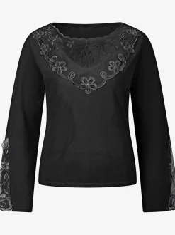 Pull en tricot fin avec encolure V et manches évasées ornées de dentelle