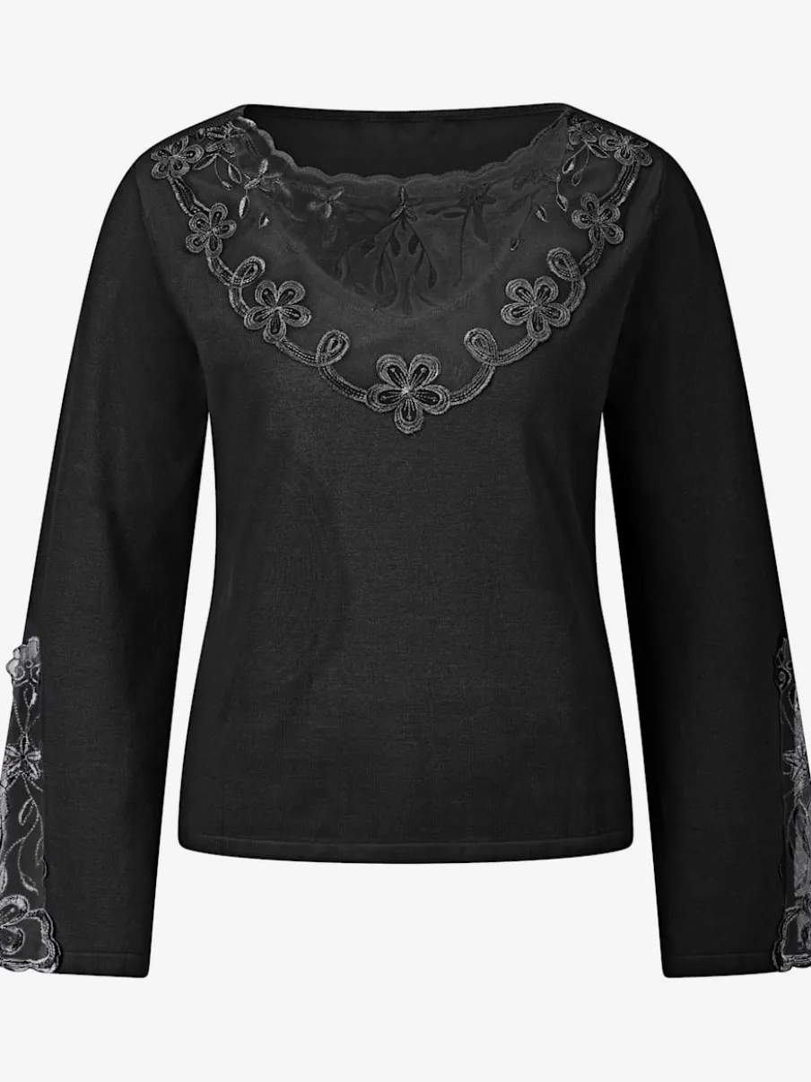 Pull en tricot fin avec encolure V et manches évasées ornées de dentelle