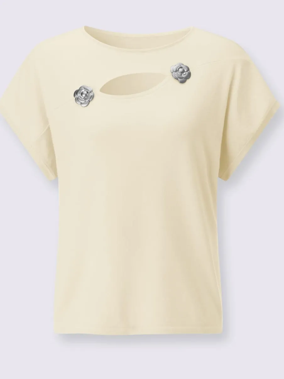 Pull à fleurs et découpes avec encolure en U