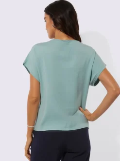 Pull à fleurs et découpes avec encolure en U