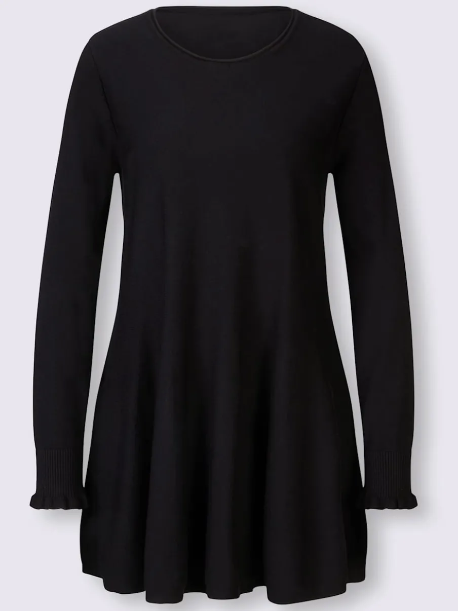 Pull long légèrement évasé avec bords roulés et volants