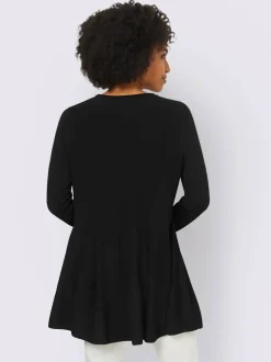 Pull long légèrement évasé avec bords roulés et volants
