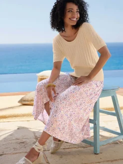 Pull à manches courtes avec motif ajouré et bord ondulé