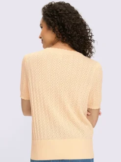 Pull à manches courtes avec motif ajouré et bord ondulé