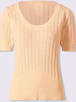 Pull à manches courtes avec motif ajouré et bord ondulé