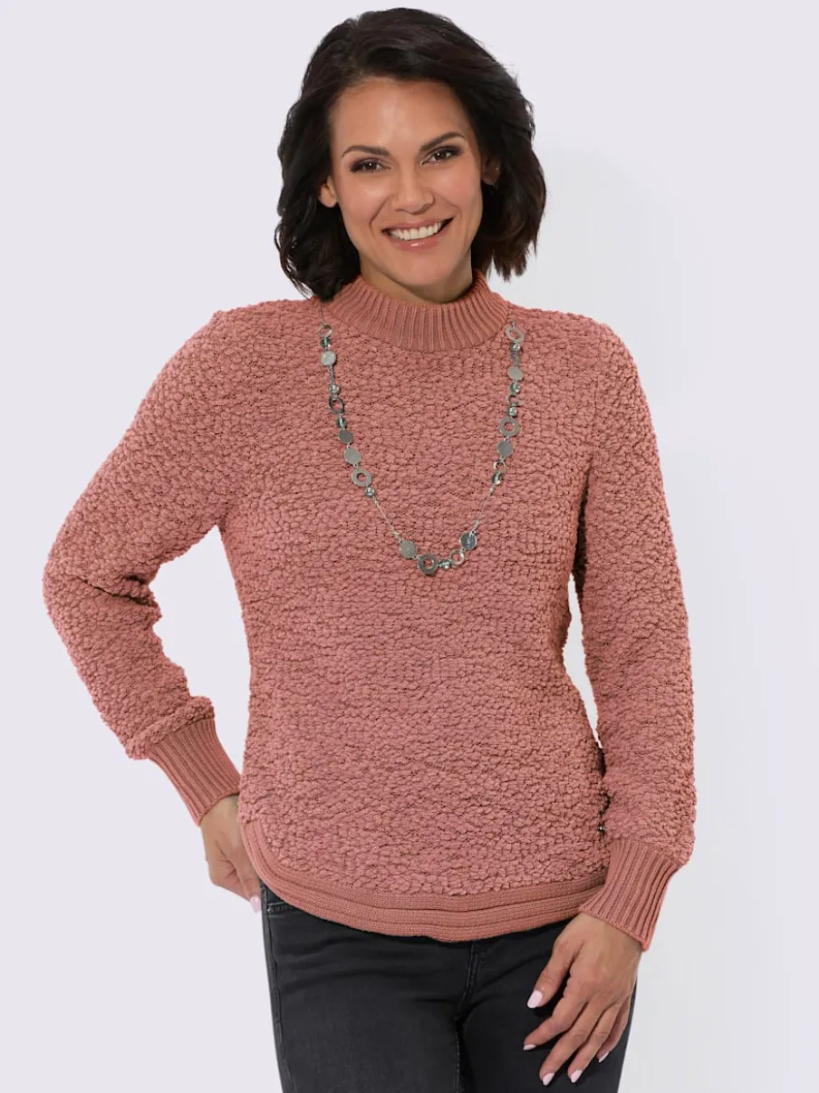 Pull tricoté doux avec col montant et finitions côtelées