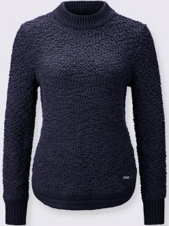 Pull tricoté doux avec col montant et finitions côtelées