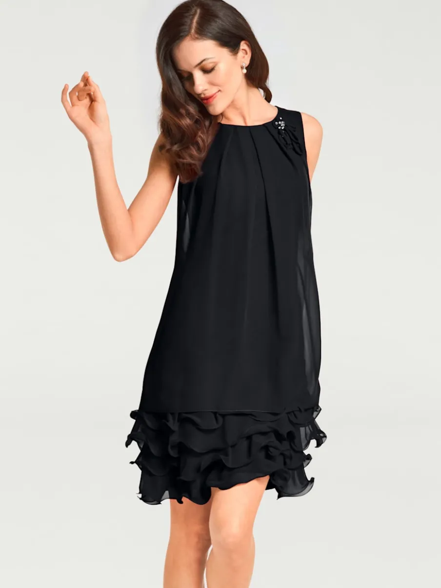 Robe de cocktail à encolure ronde et sans manches avec volants