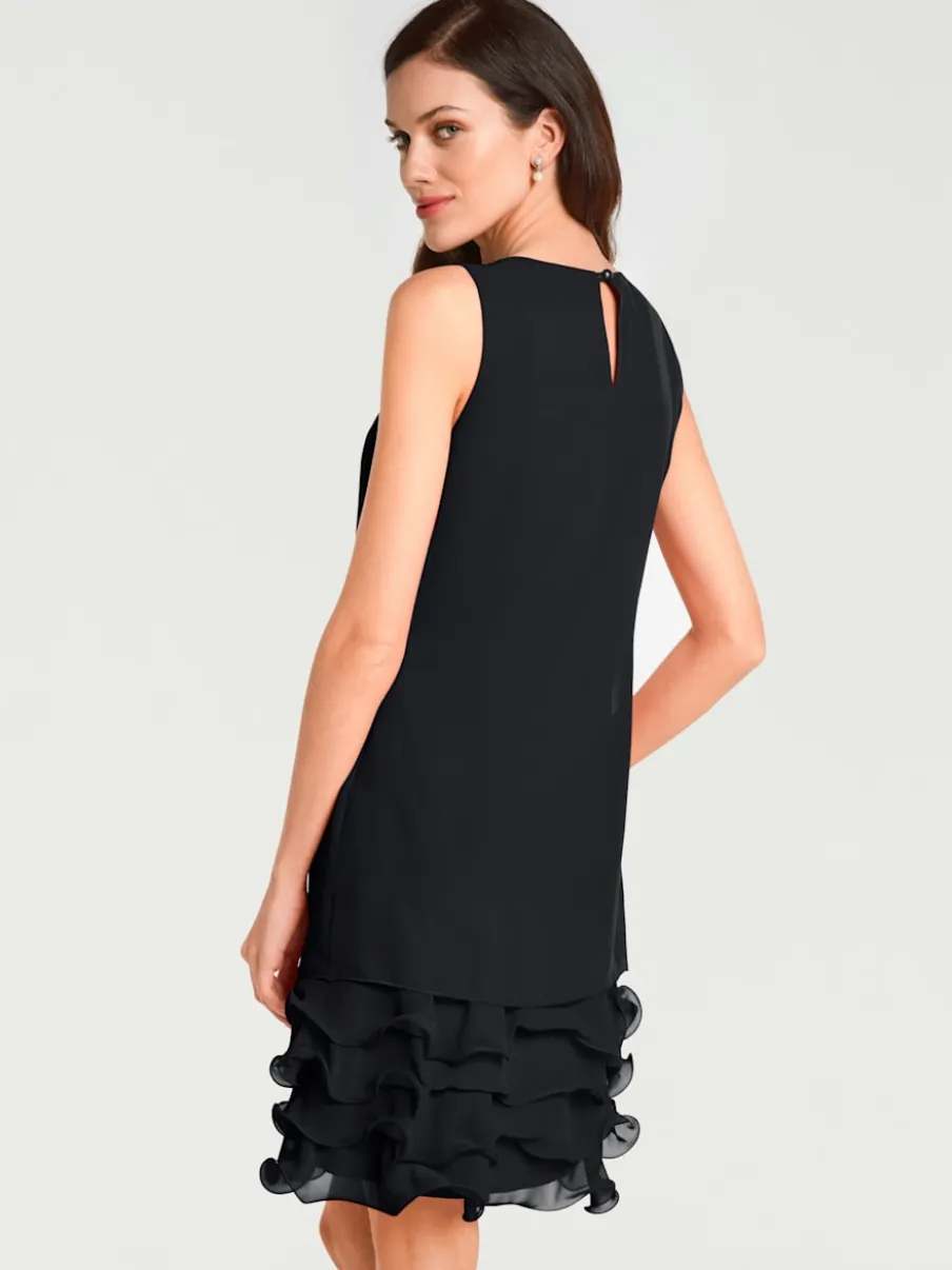 Robe de cocktail à encolure ronde et sans manches avec volants