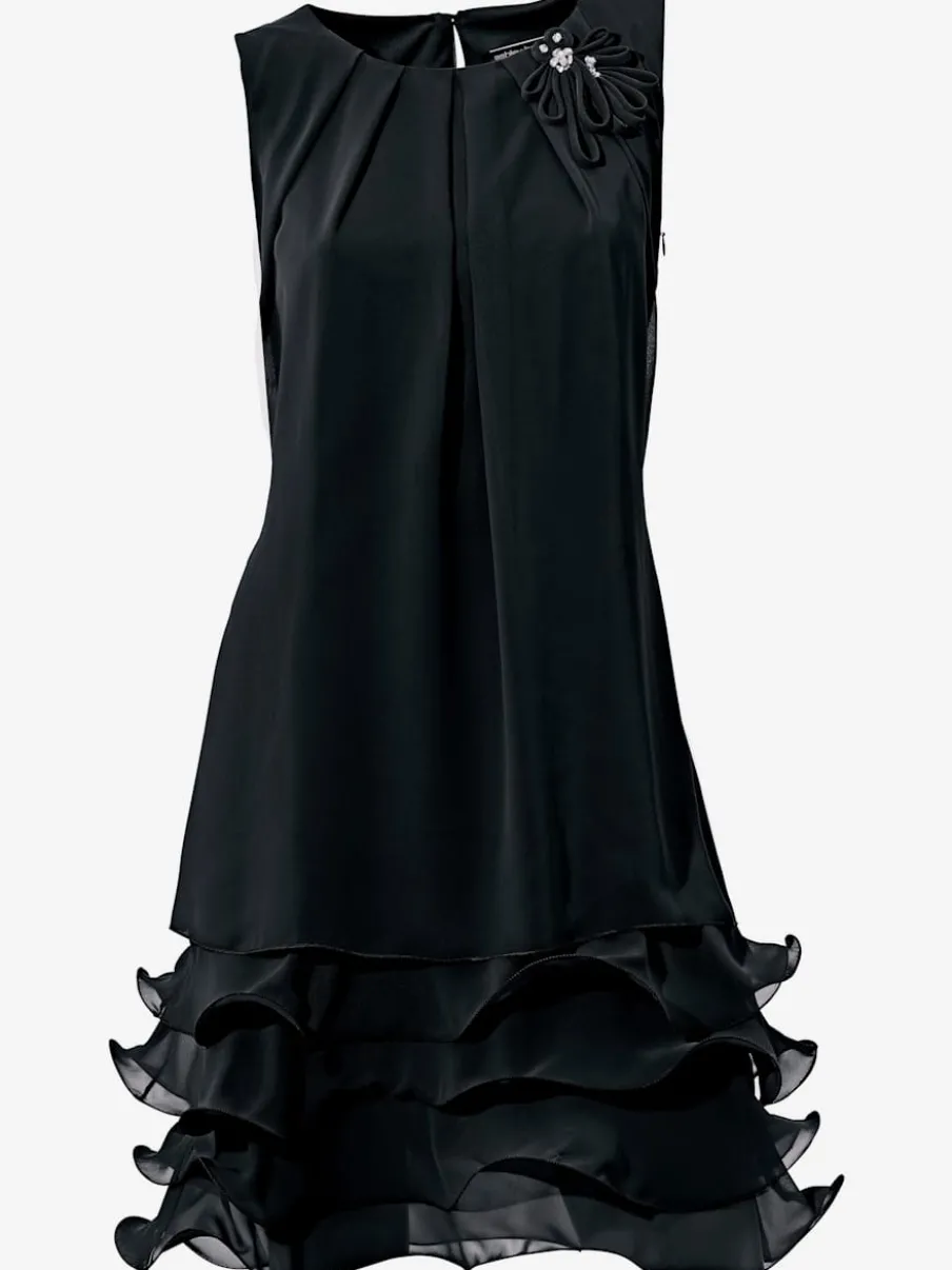 Robe de cocktail à encolure ronde et sans manches avec volants